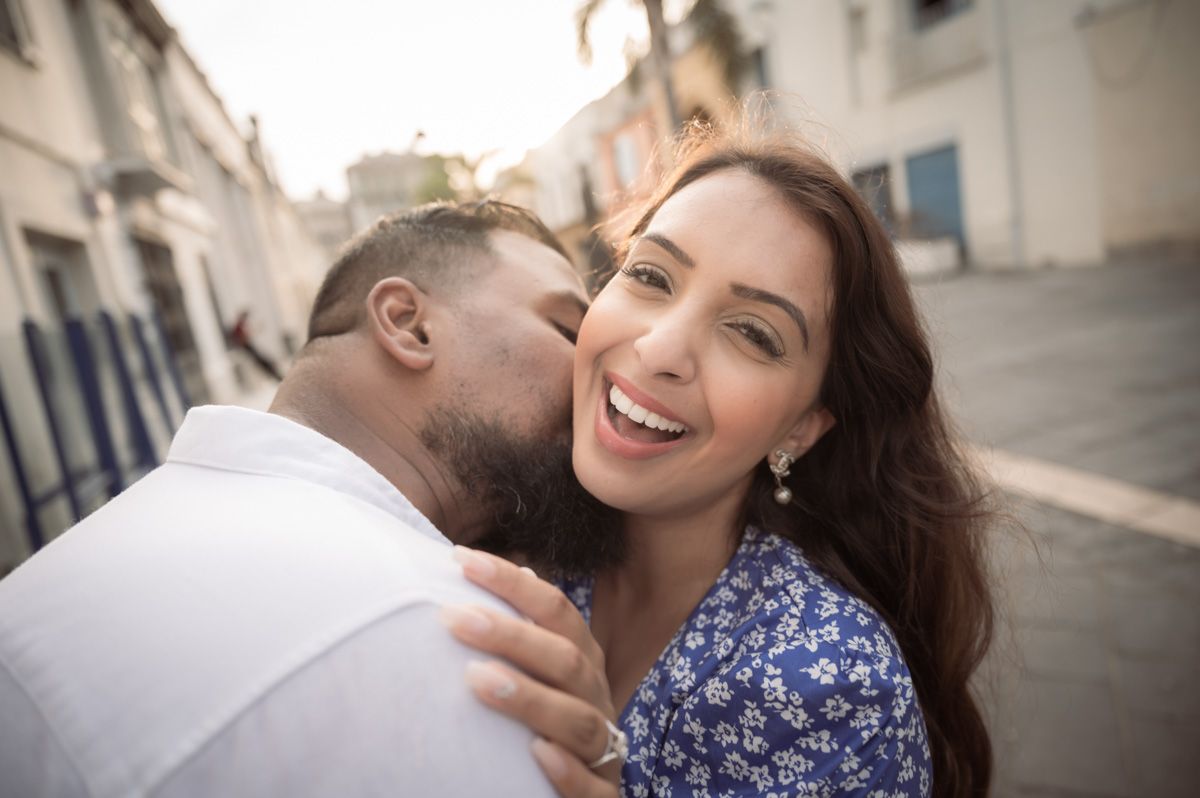 A couple laugh during a photoshoot in Nice, France