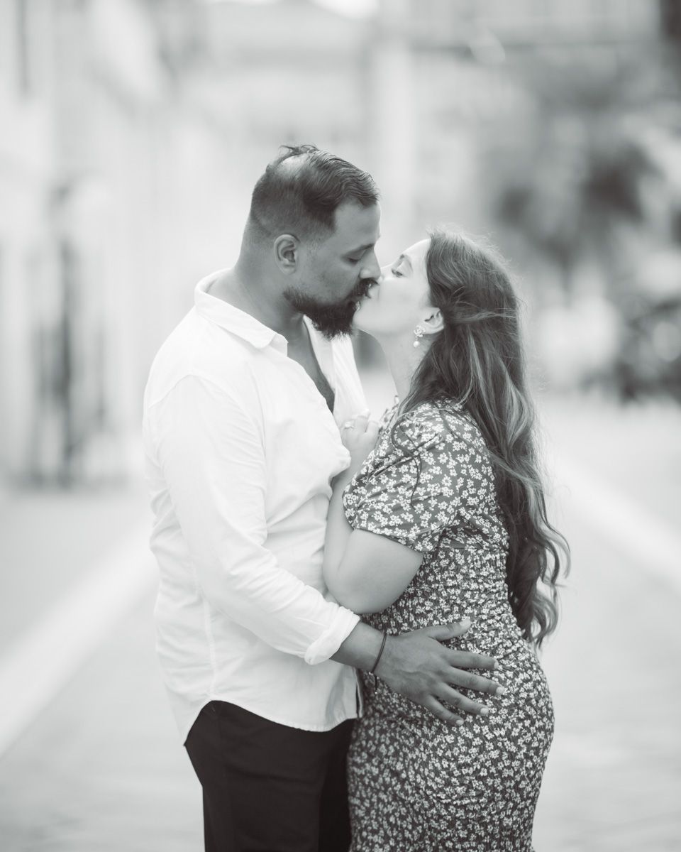 A couple embrace during a romantic photoshoot