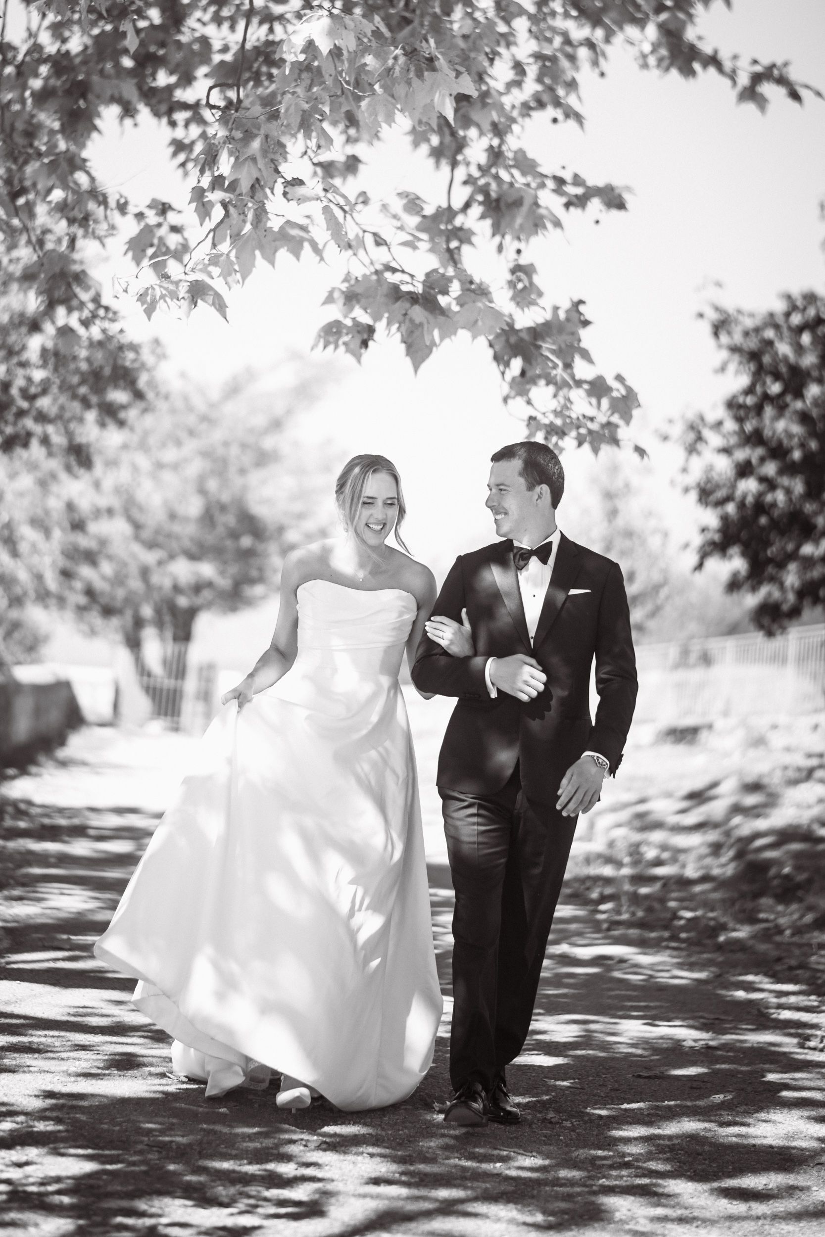 A couple eloping laugh during a natural, spontaneous photoshoot in the South of France.