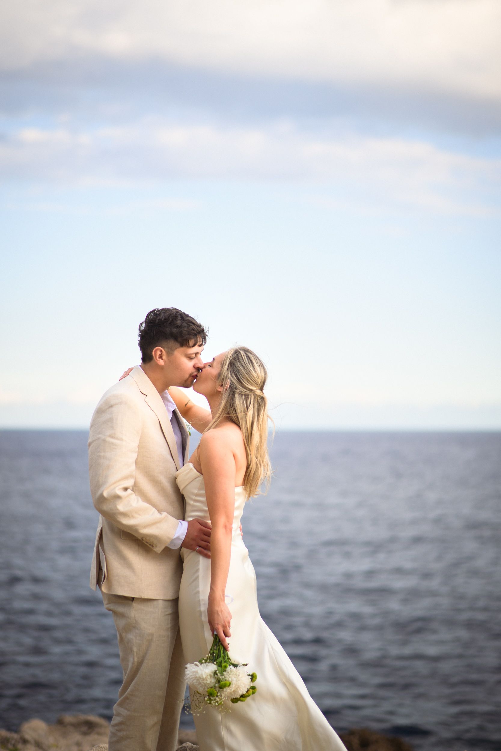 Photoshoot in wedding attire on Cap Ferrat, south of France, with sea in background.