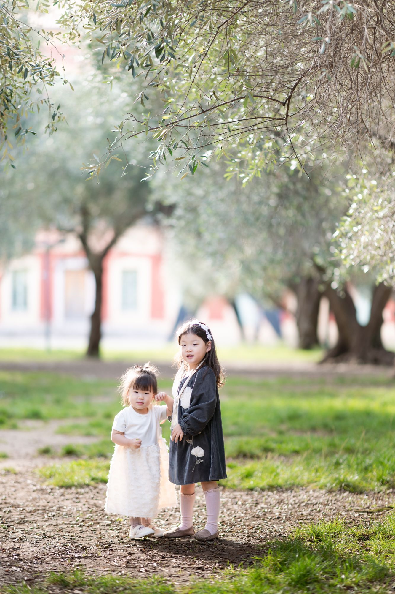 Sisters playing unposed during an autumn family photoshoot