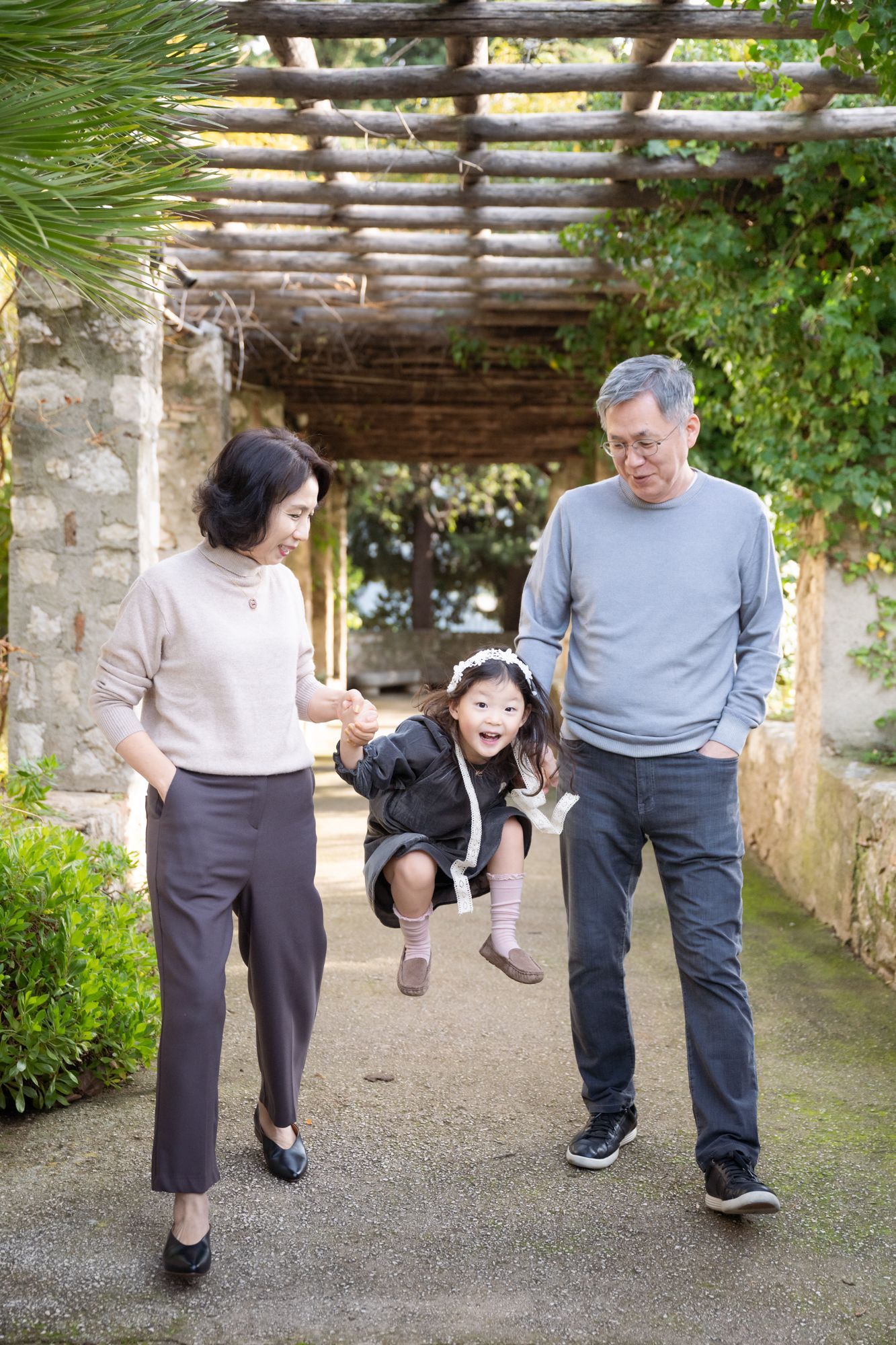 grand daughter playing with grandparents