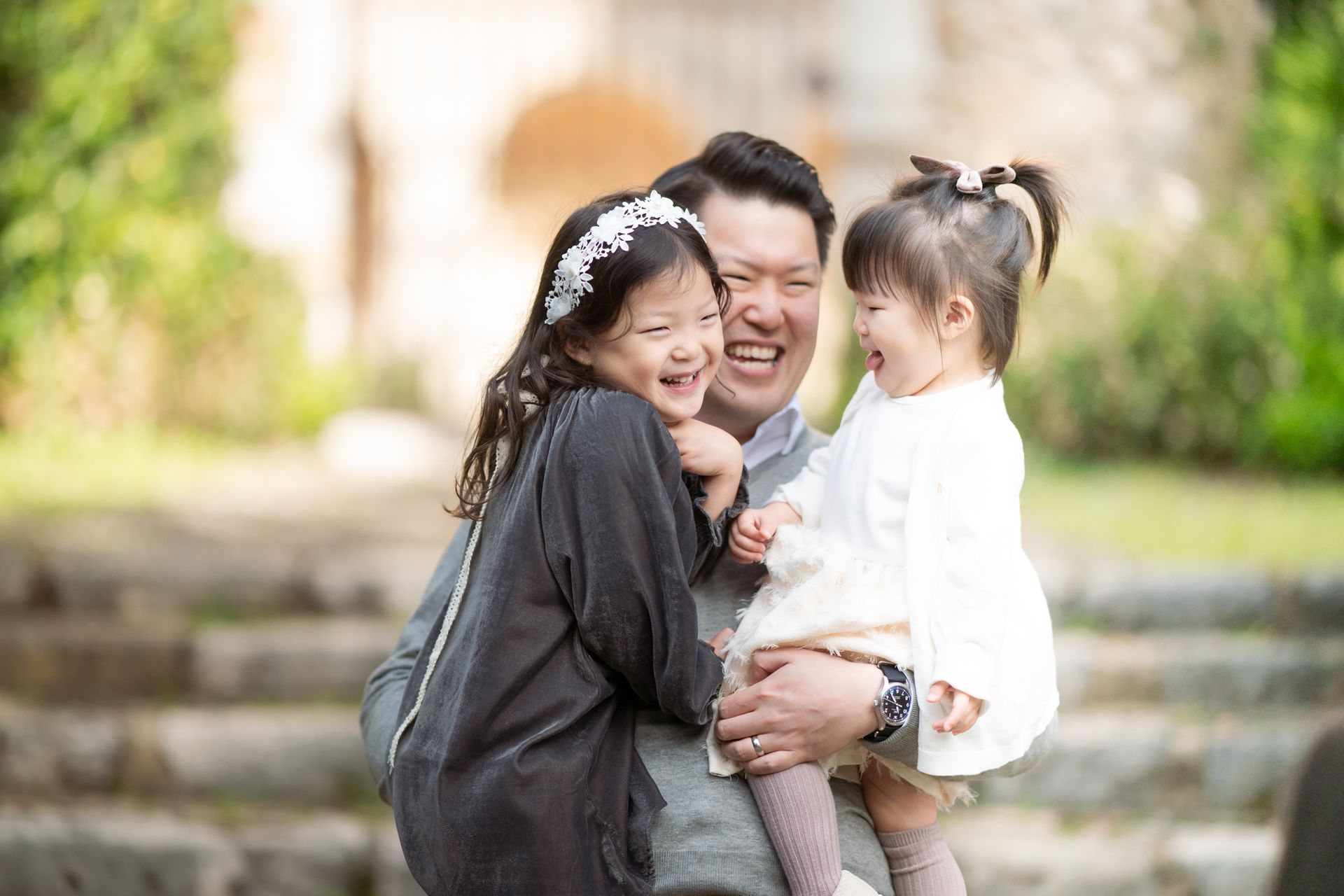 relaxed, unposed family photography image of father with daughters