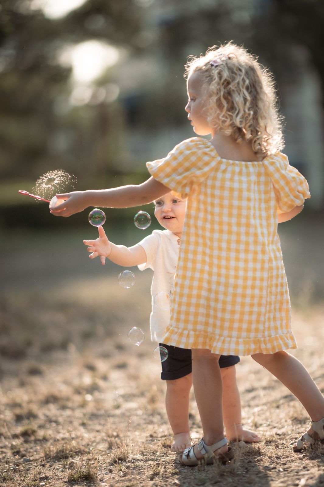 children playing with bubbles