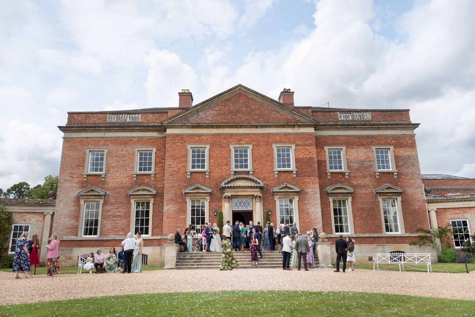 Exterior wide angle image of the front of Kelmarsh Hall wedding venue.