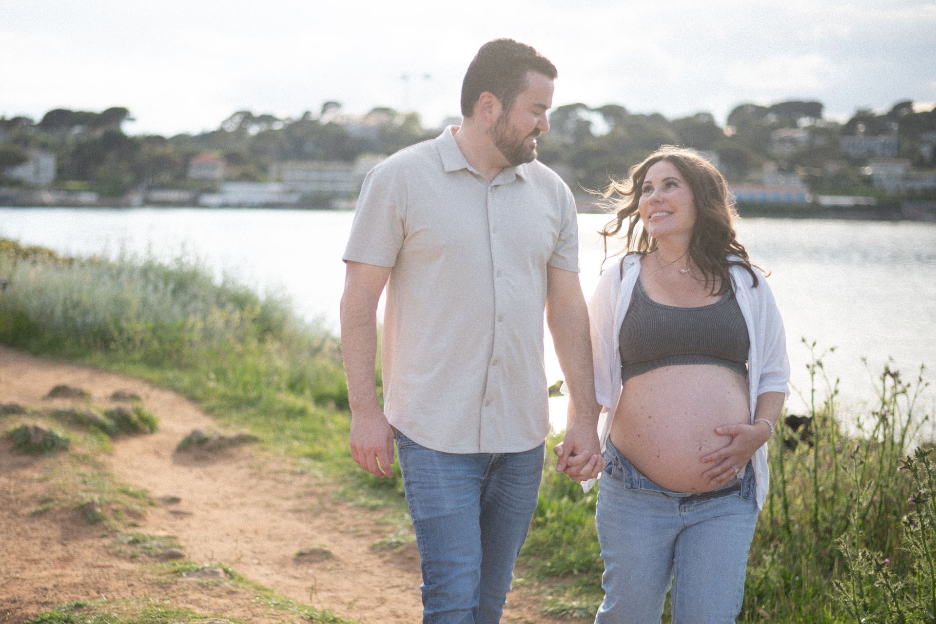 A candid image of a couple during maternity photoshoot.