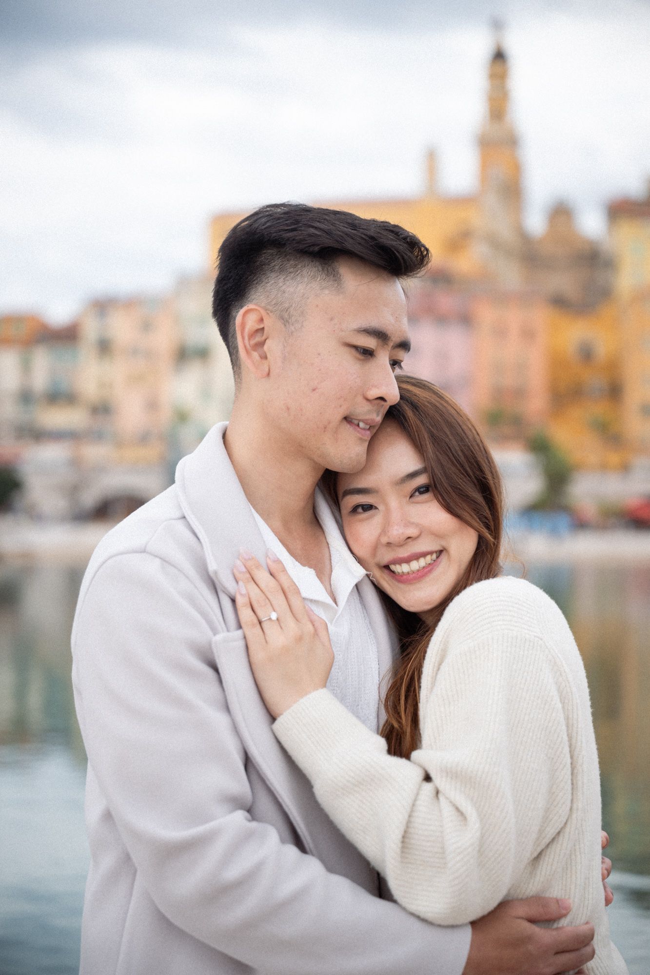 a couple hug and laugh in Menton during a romantic couple shoot