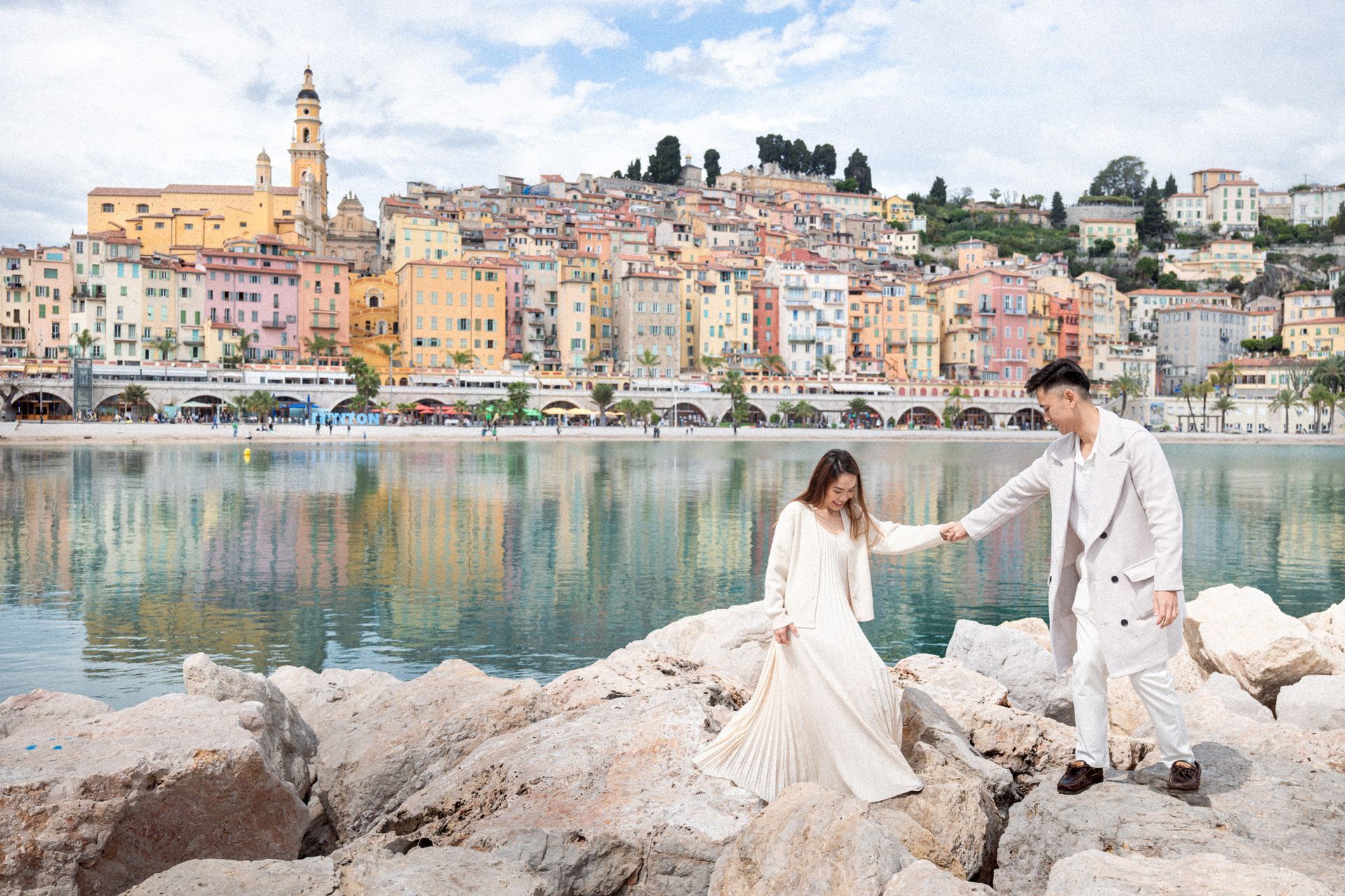 A newly engaged couple before pose for photos on Menton's stunning old town.
