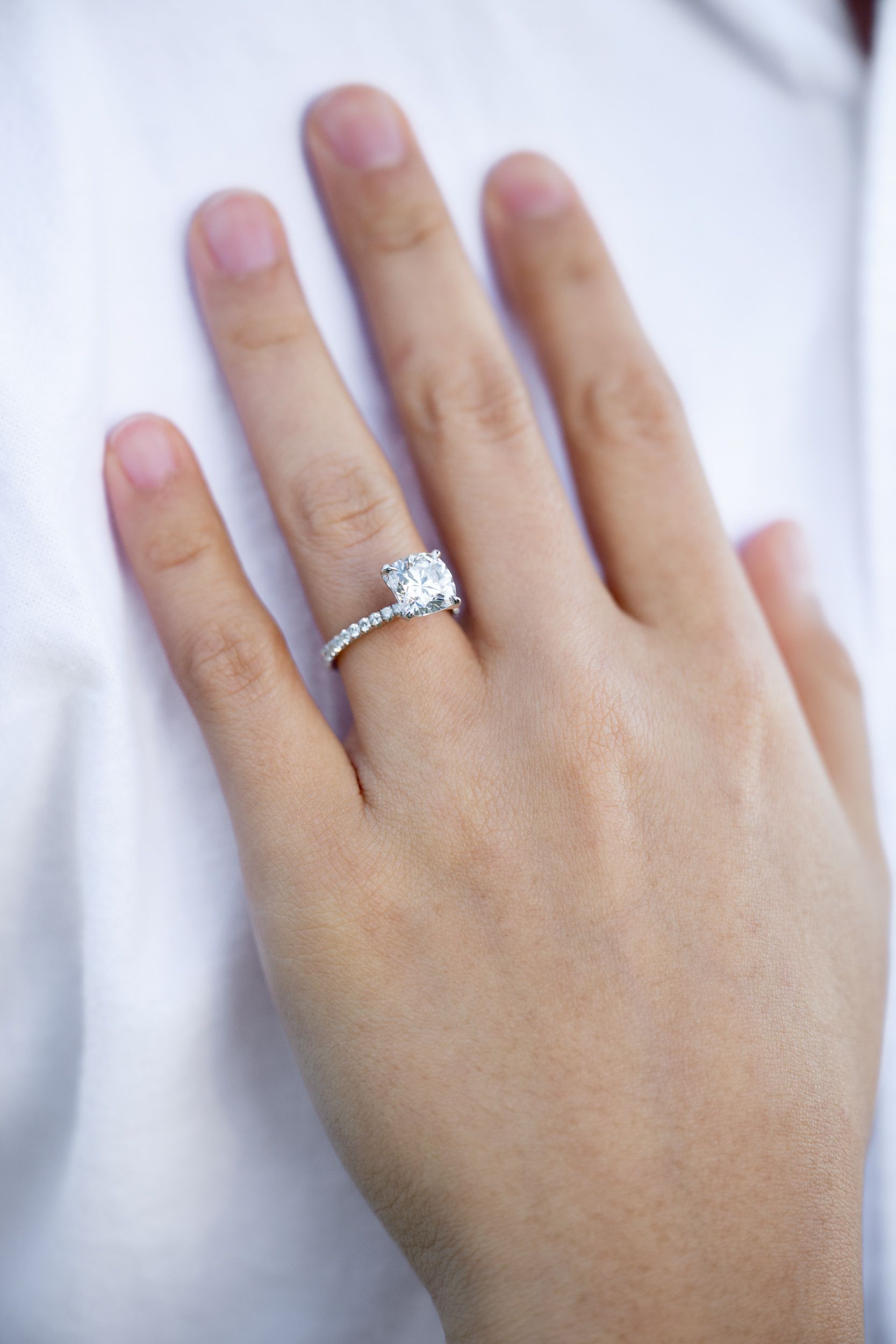 A close up of an engagement ring.