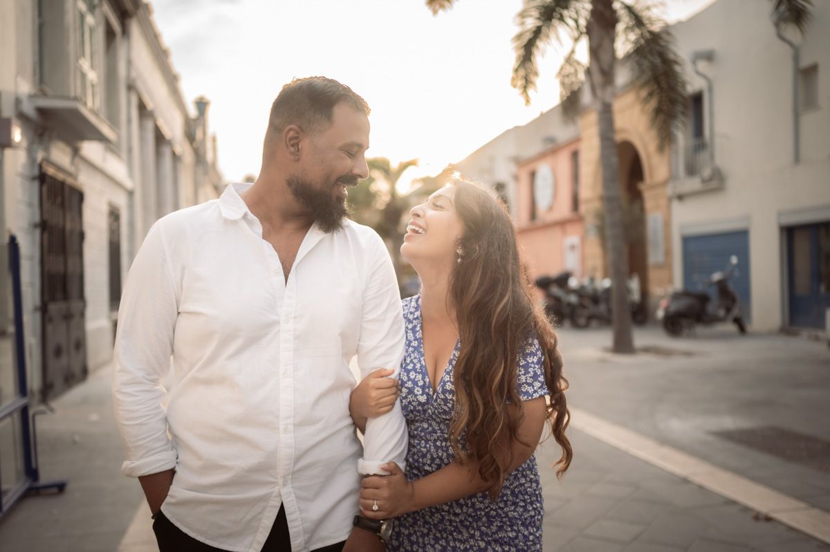 A couple before the sunset in Nice's old town during a photoshoot by a couple photographer in Nice