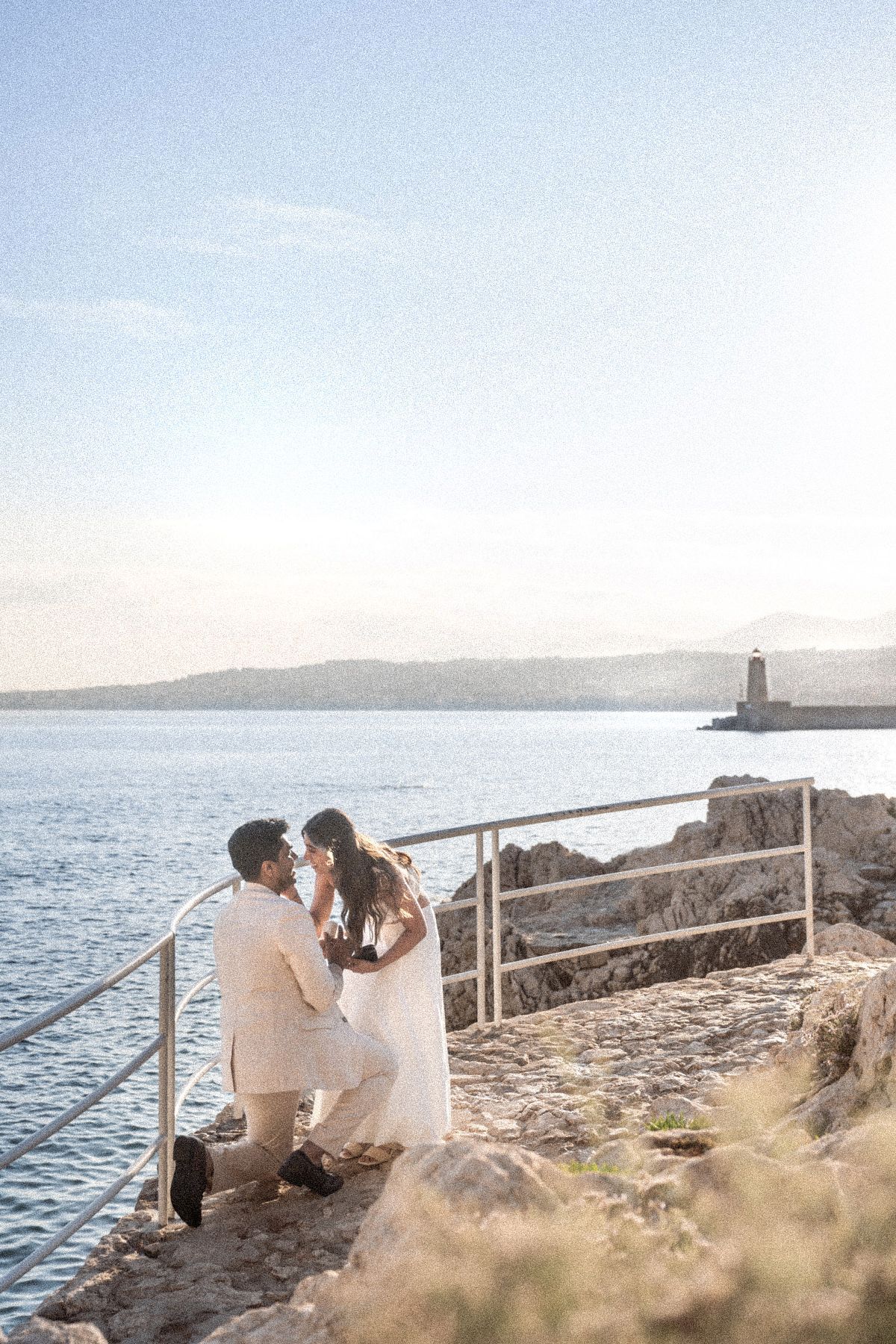 A man proposing on one knee in Nice, France, before the sunset. 