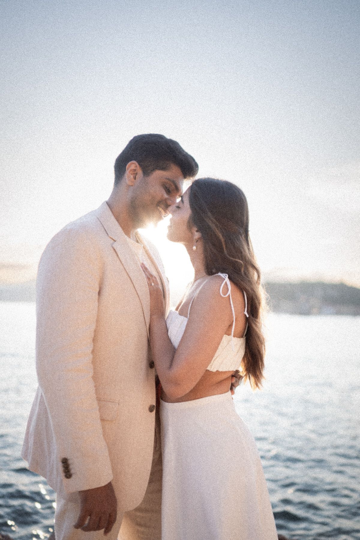 A couple embrace during a professional photoshoot on the French Riviera.
