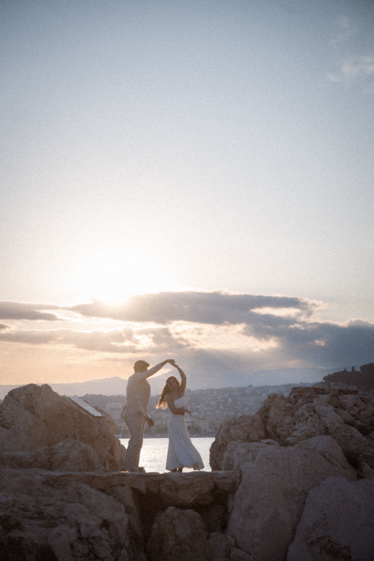 a dramatic couple pose during sunset on the French Riviera.