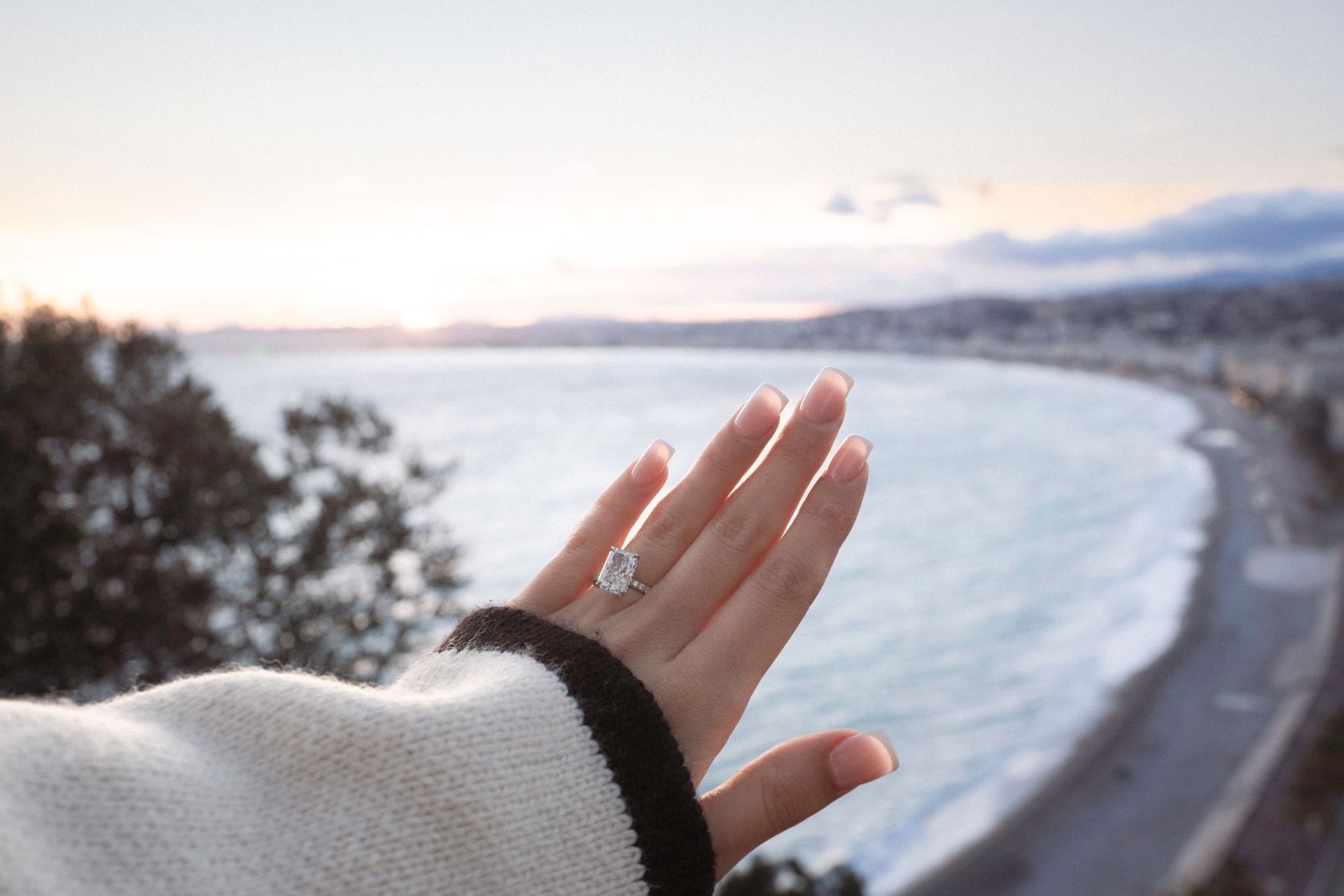 An engagement ring with the Promenade des Anglais in the background
