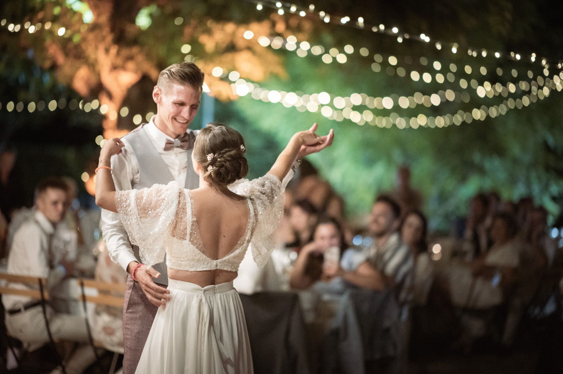 A beautiful first dance under fairy lights