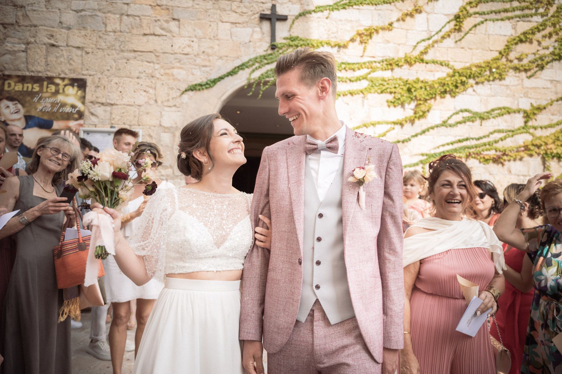 the couple emerge from the church