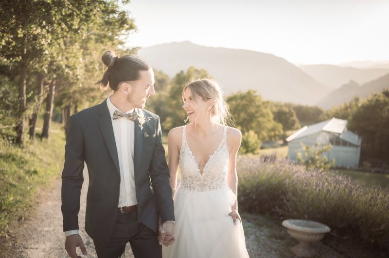 A bride and groom laugh and smile during a professional couple photoshoot at Domaine de Glandeve