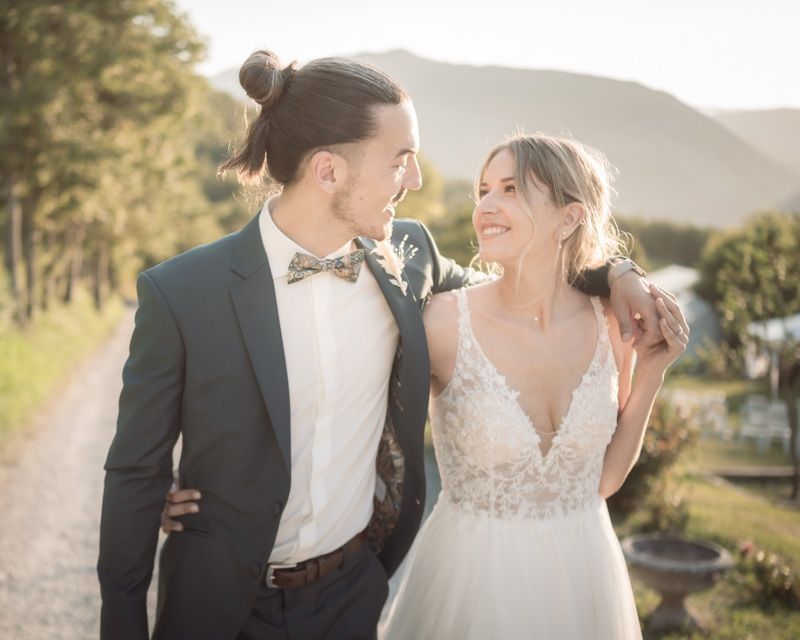 A bride and groom laugh and smile during a professional couple photoshoot at Domaine de Glandeve