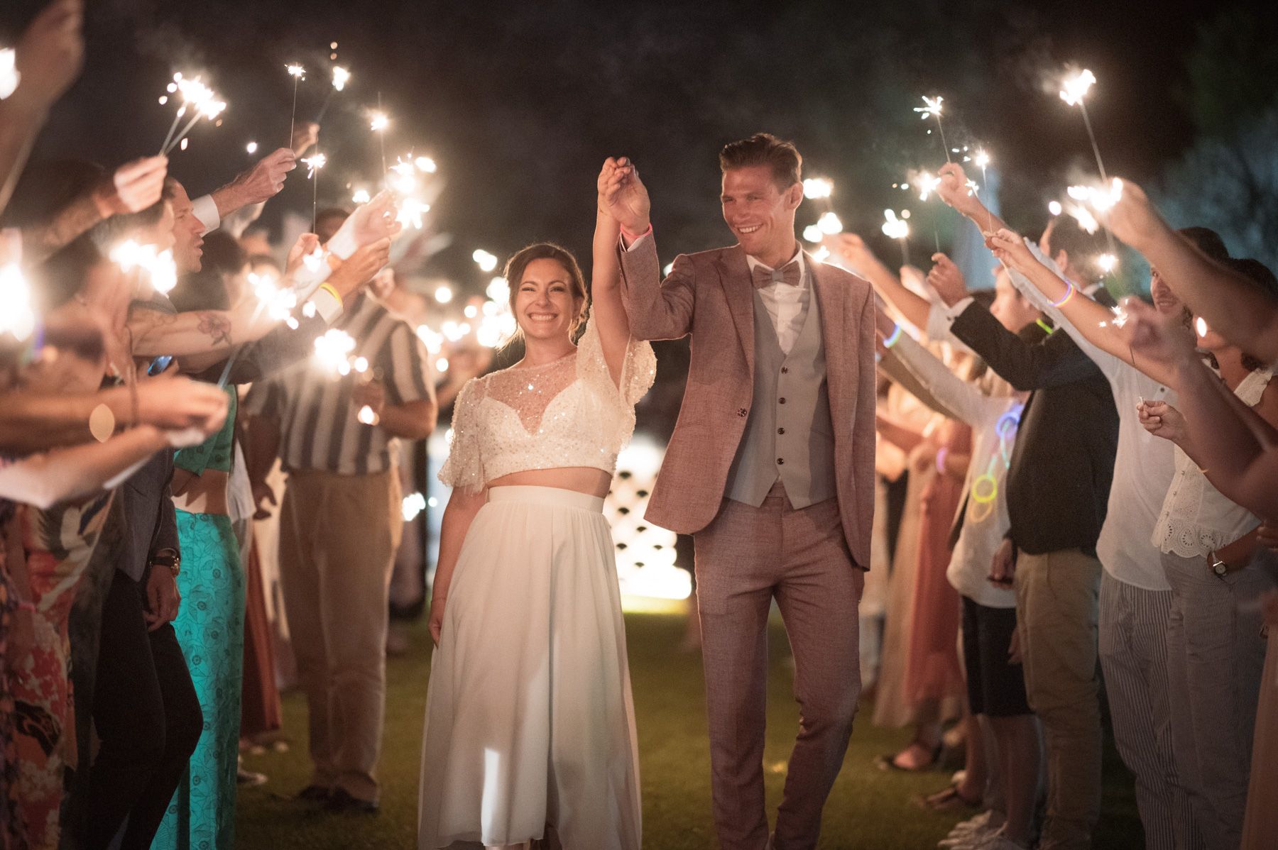 wedding sparklers tunnel at night time
