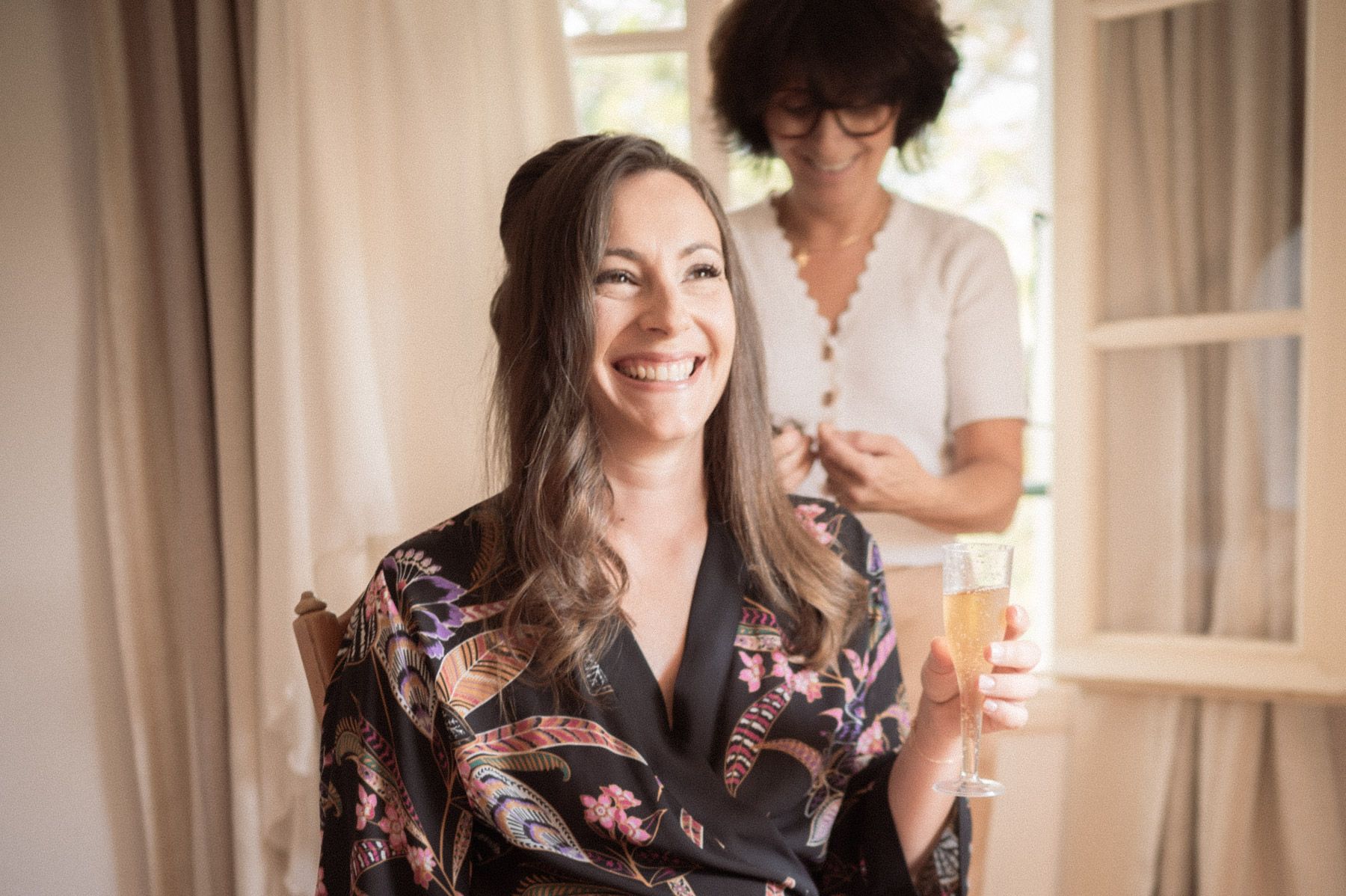 bride smiles with champaign