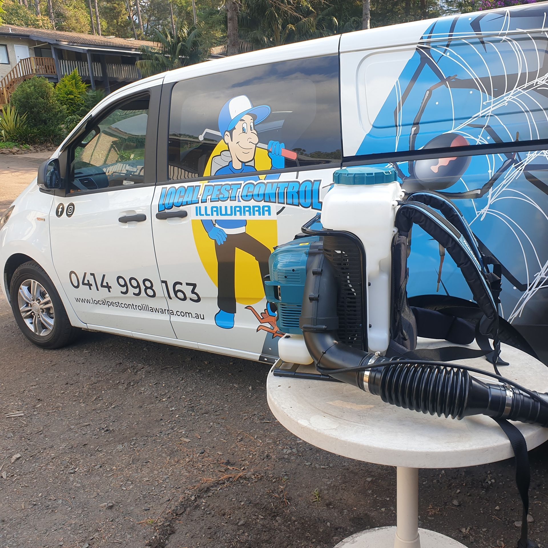 A Cricket Bat Is Sitting On A Cooler Next To A Truck — Local Pest Control Illawarra in Albion Park, NSW