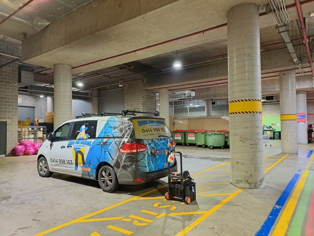 A Blue And White Van Is Parked In A Parking Lot — Local Pest Control Illawarra in Horsley, NSW