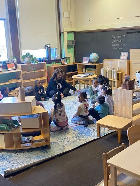 Montessori child smiling in the classroom
