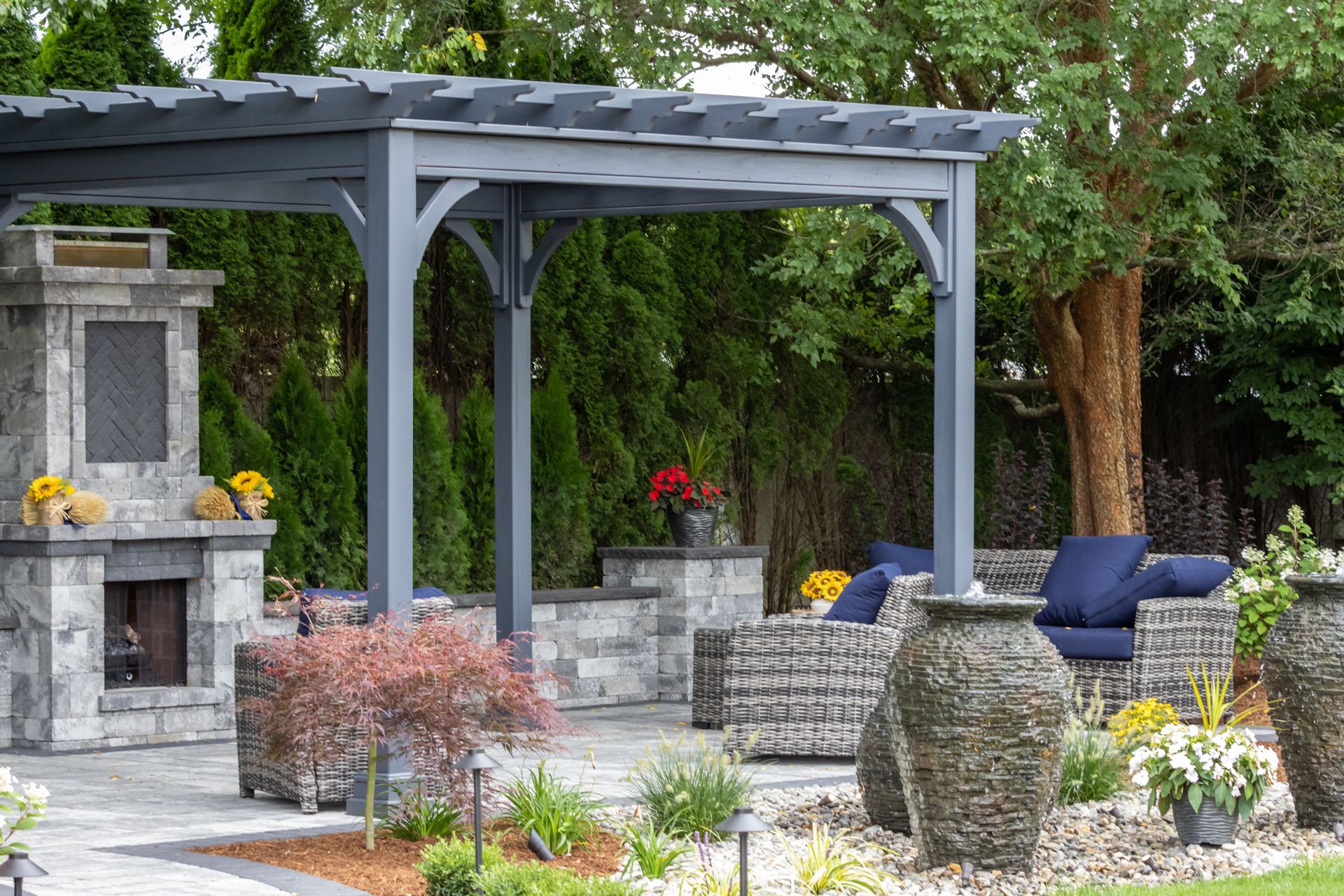 Patio With a Pergola and a Fireplace 