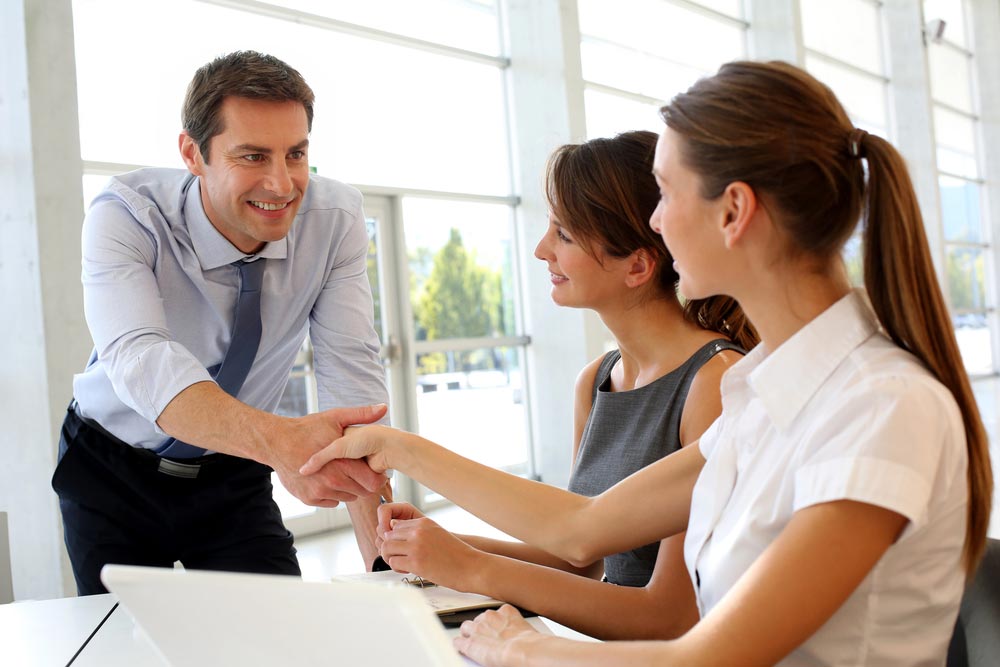 A Guy Shaking Hands To Clients — Mortgage Brokers In Mundingburra, QLD