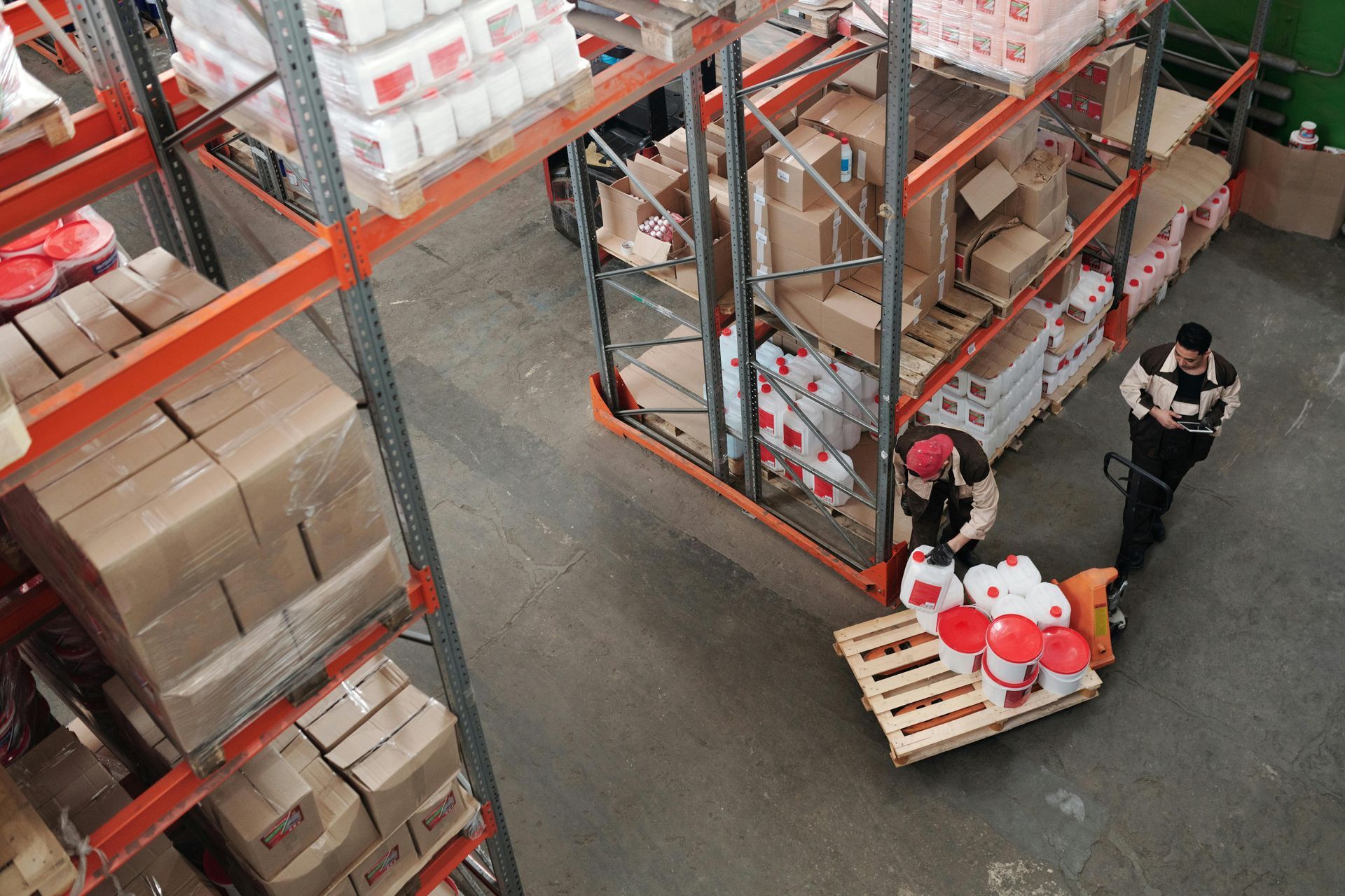 A group of people are working in a warehouse.