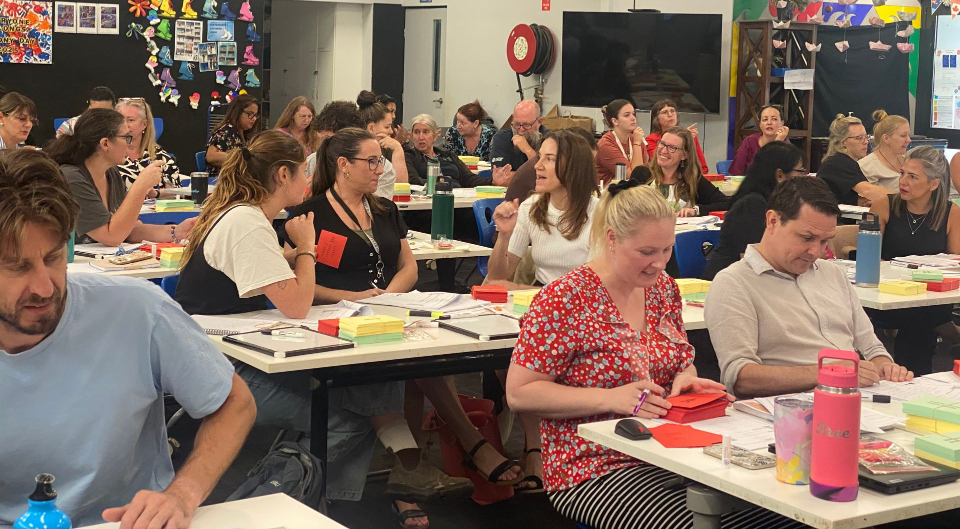 Teachers using their Morphology card decks as they practice using the cards for classroom application during Advanced Morphology training.
