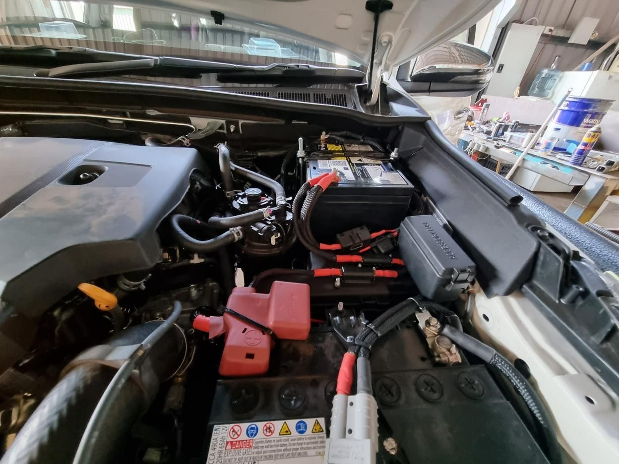 The Engine of A Car with The Hood Open and The Battery Visible — D.J. Auto Electrics NT in Berrimah, NT