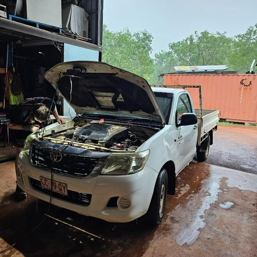 A White Truck with The Hood up Is Parked in A Garage — D.J. Auto Electrics NT in Berrimah, NT