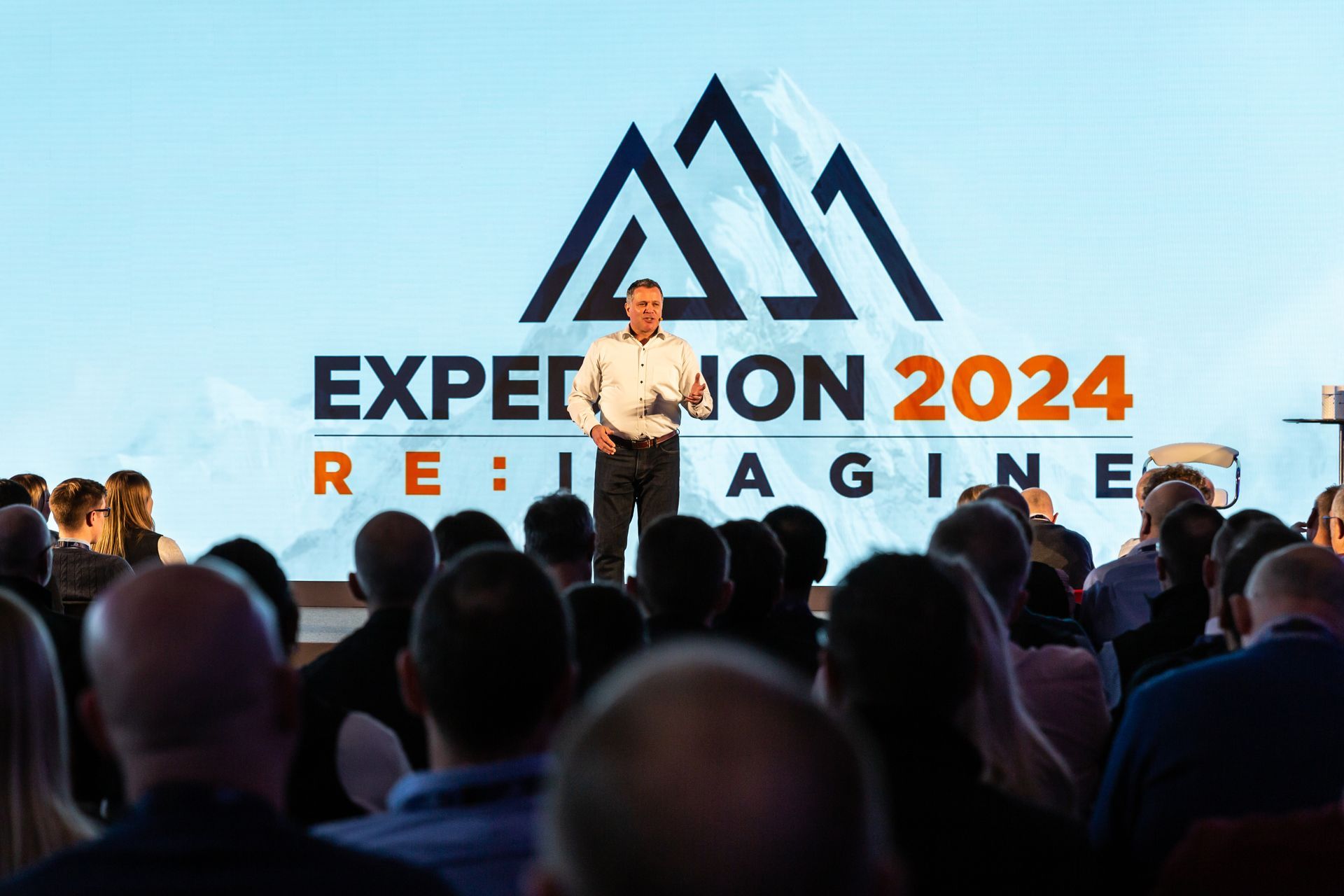 Man speaking at a conference 