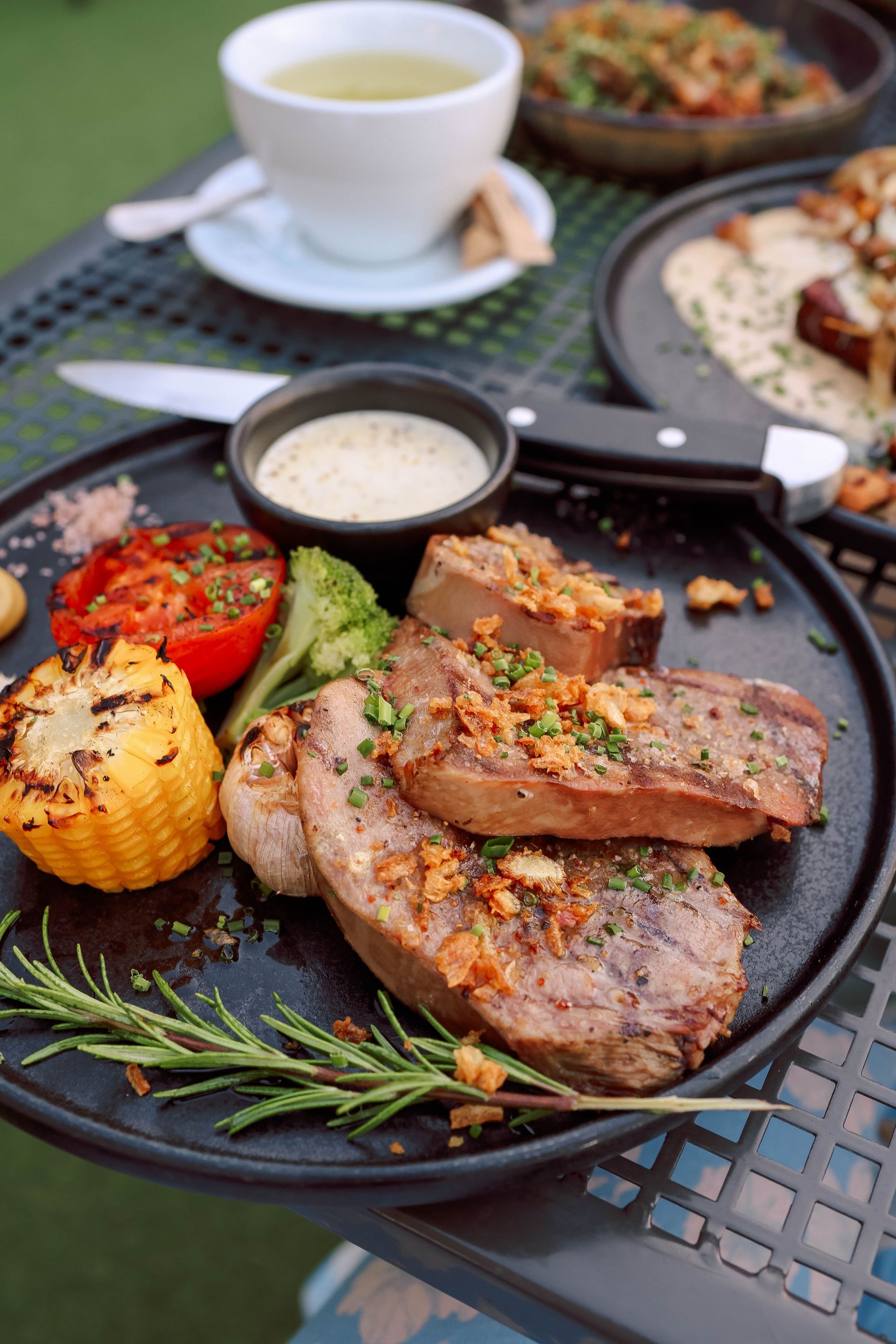 Grilled beef striploin with grilled corn and sauce