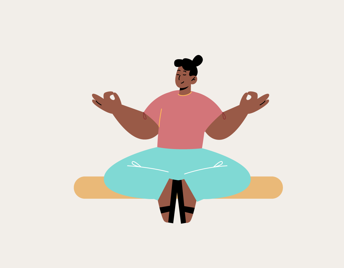 A woman is sitting in a lotus position with her legs crossed.