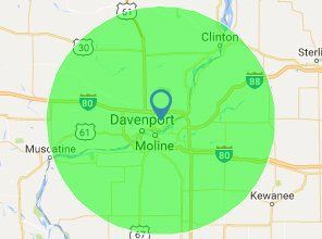 Map of Davenport, Moline, and Clinton with a green circular coverage area centered on a location pin.
