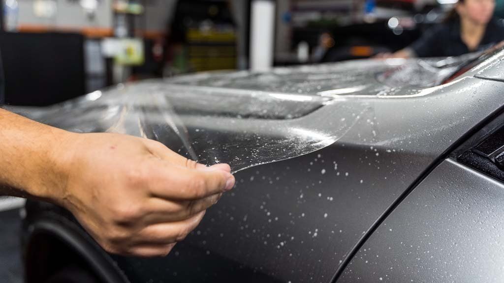 applying paint protection film onto a car