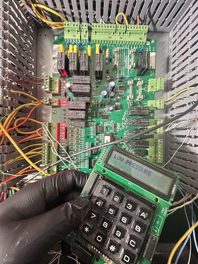 Hand holding a keypad displaying 