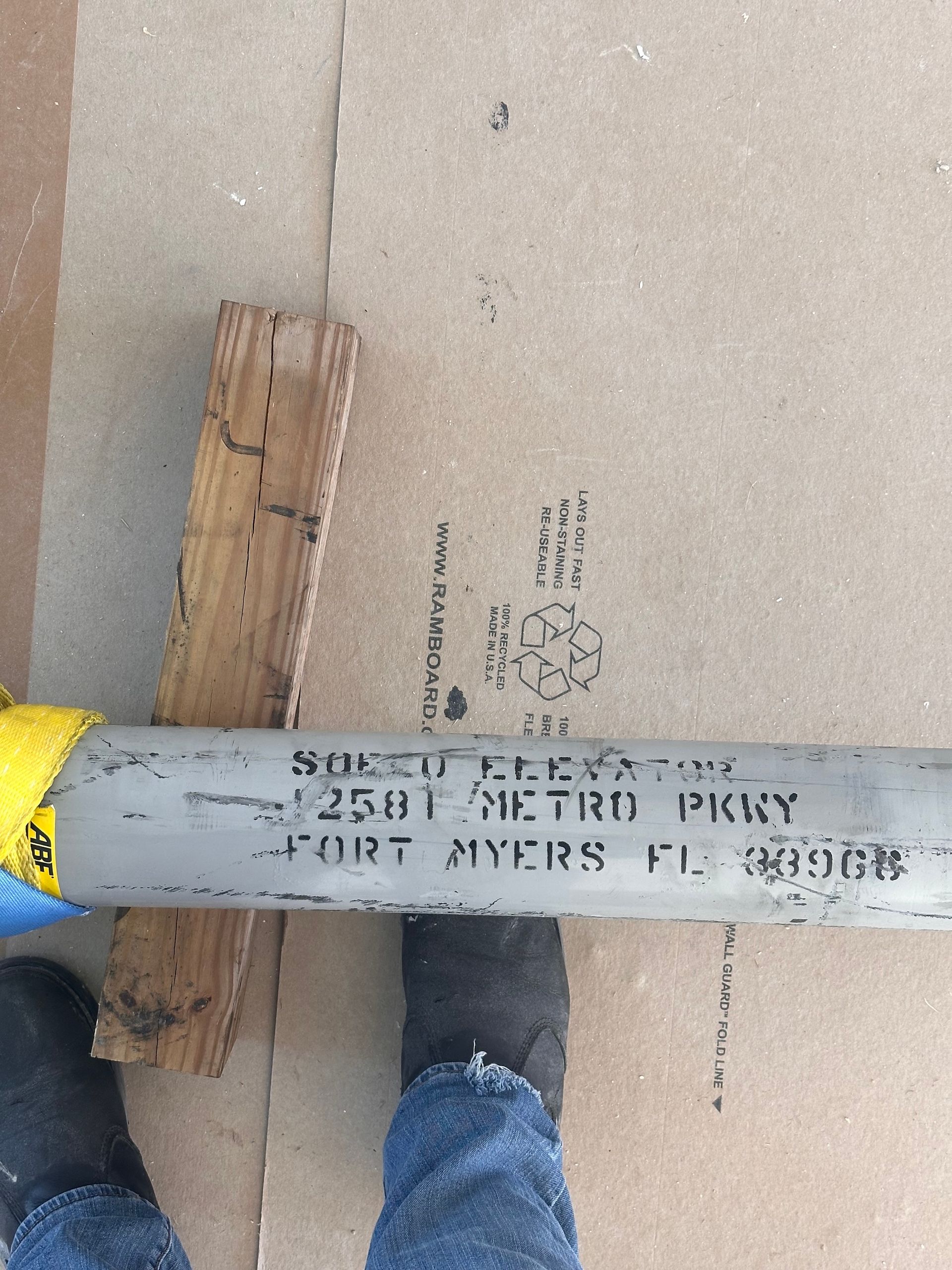 Gray pipe with text: 