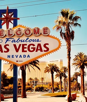 A welcome to fabulous las vegas sign with palm trees in the background