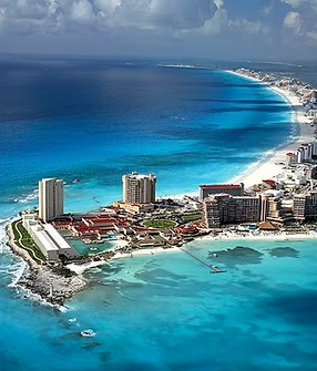 An aerial view of a city on a small island in the middle of the ocean