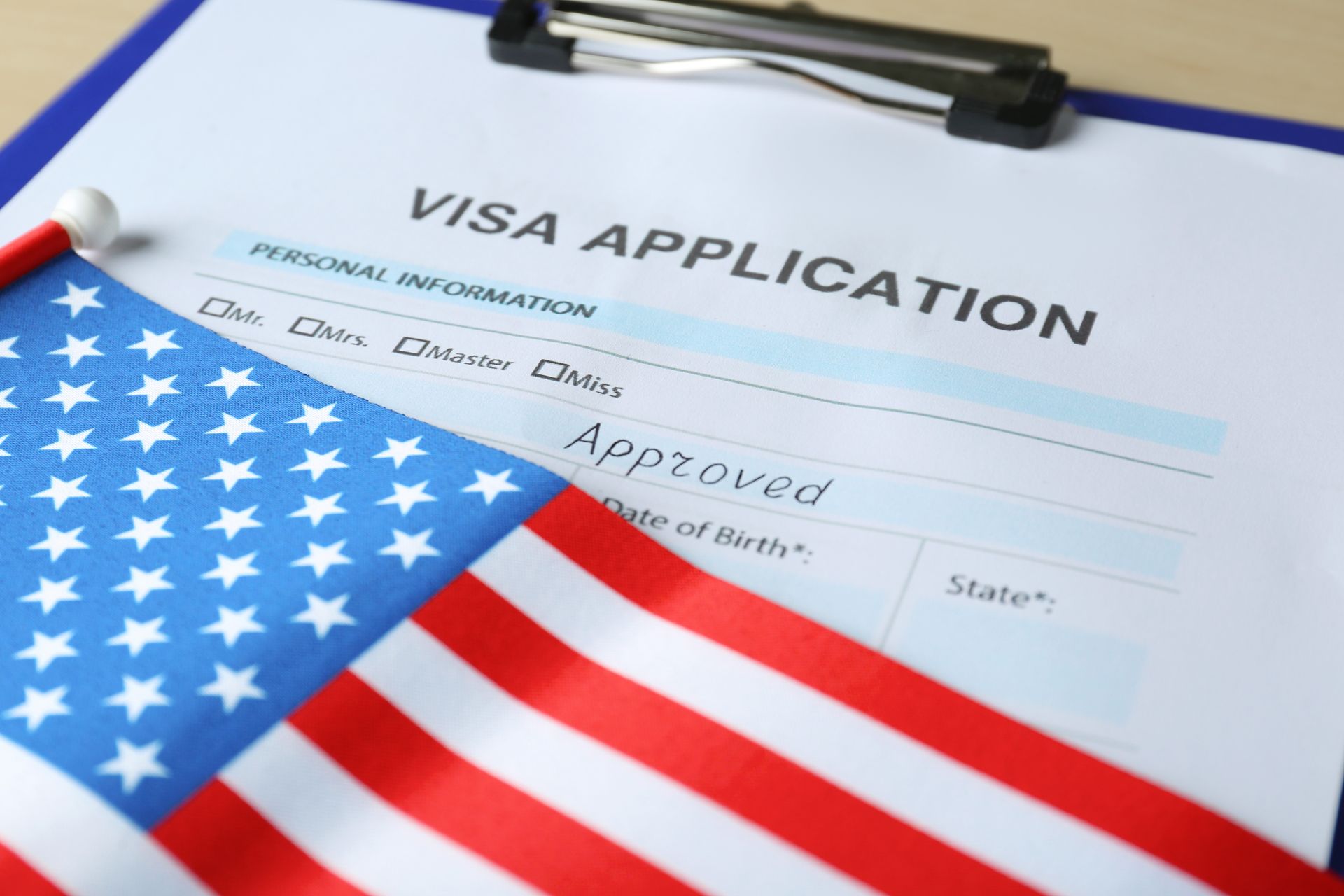 American flag next to a visa application, representing employment-based immigration in Tampa, FL.