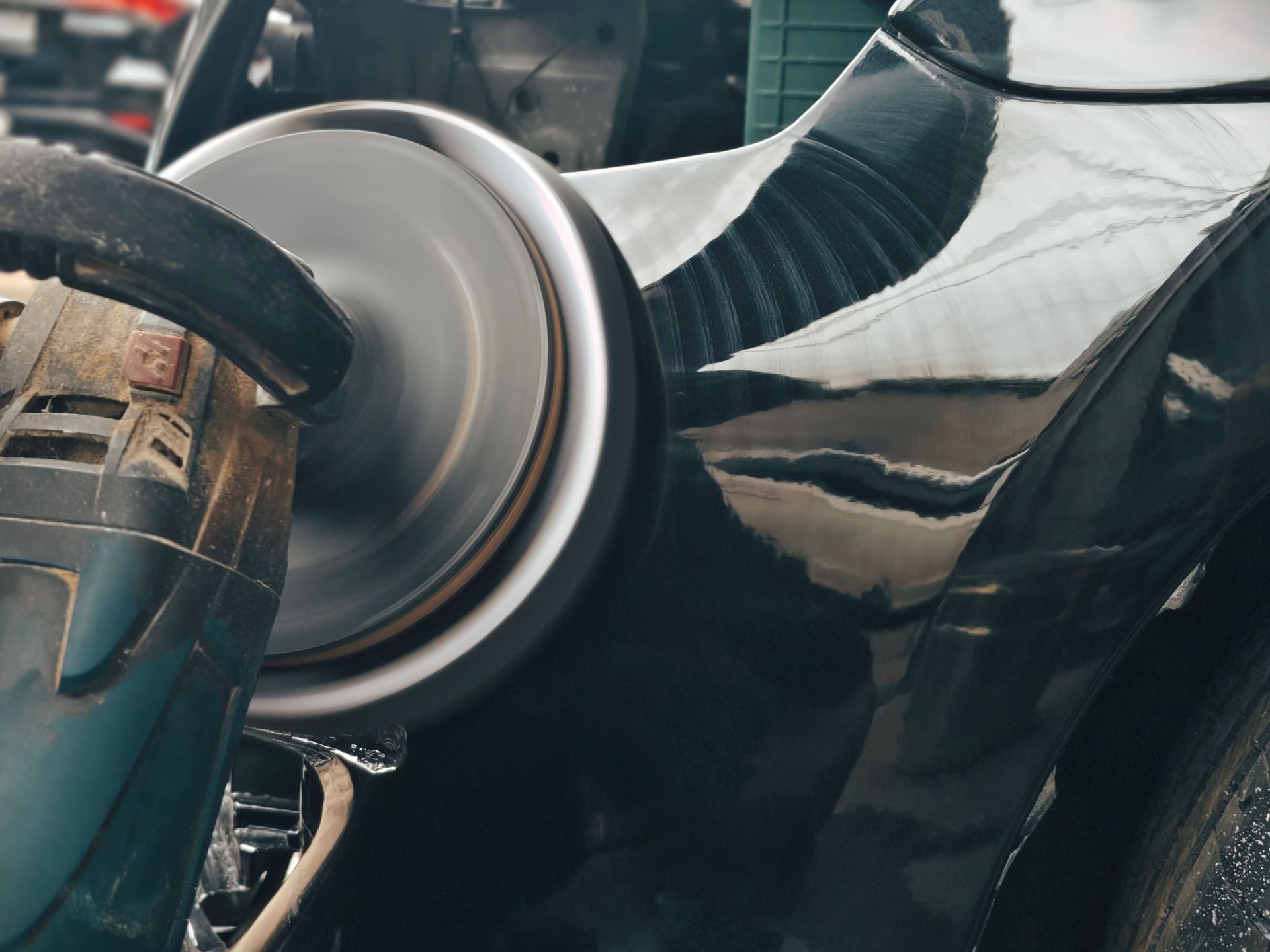 Close-up of a black motorcycle with chrome engine and rear wheel details