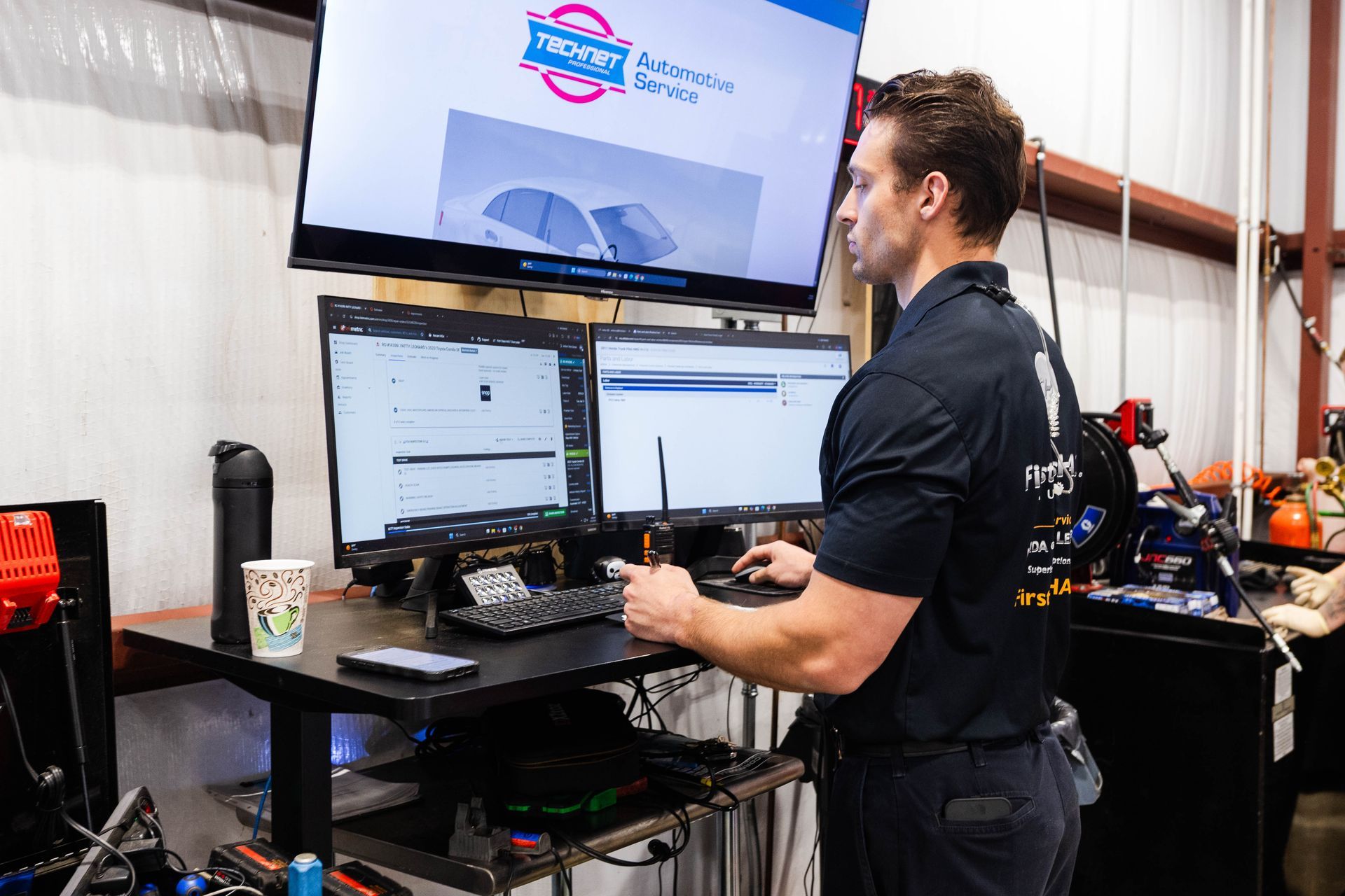 First Class HALT technician running vehicle diagnostics on advanced equipment