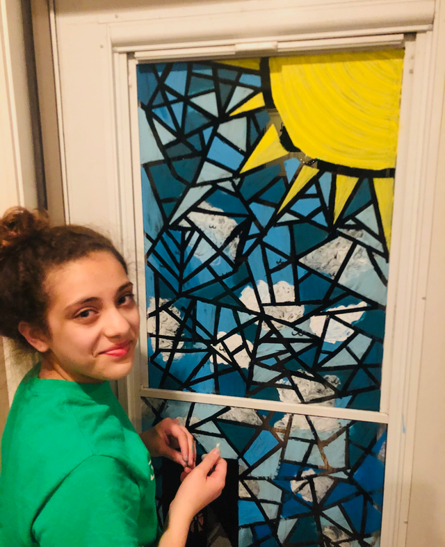 Student working on an artwork piece