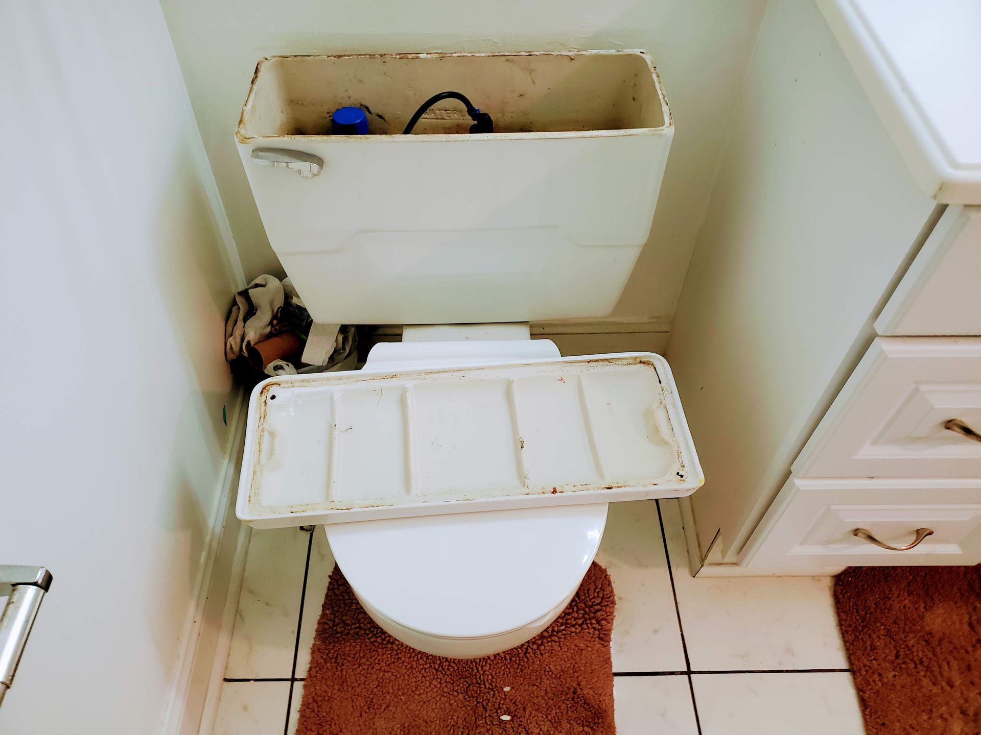 a toilet with a lid on it in a bathroom