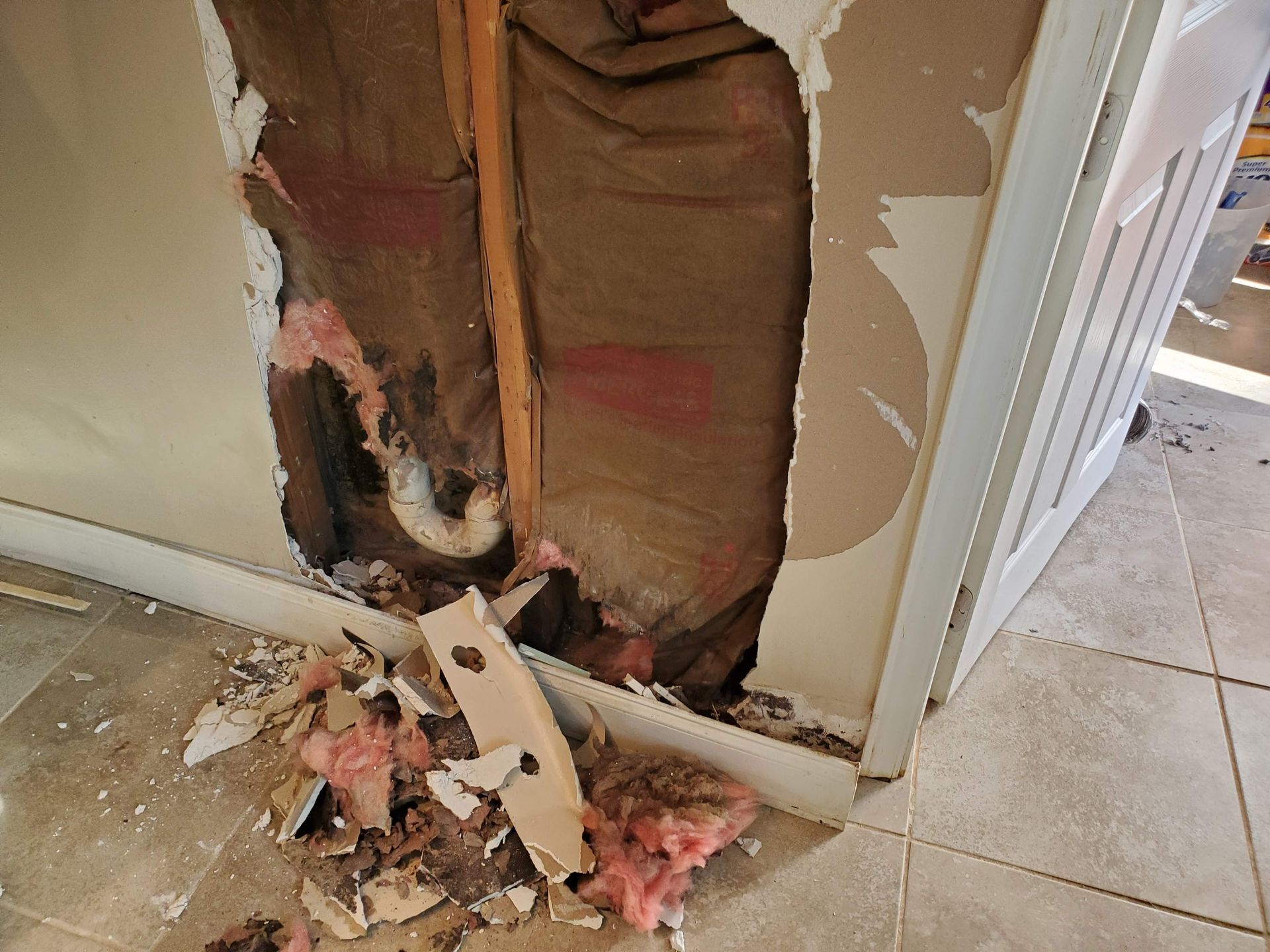 there is a hole in the wall in the corner of the room