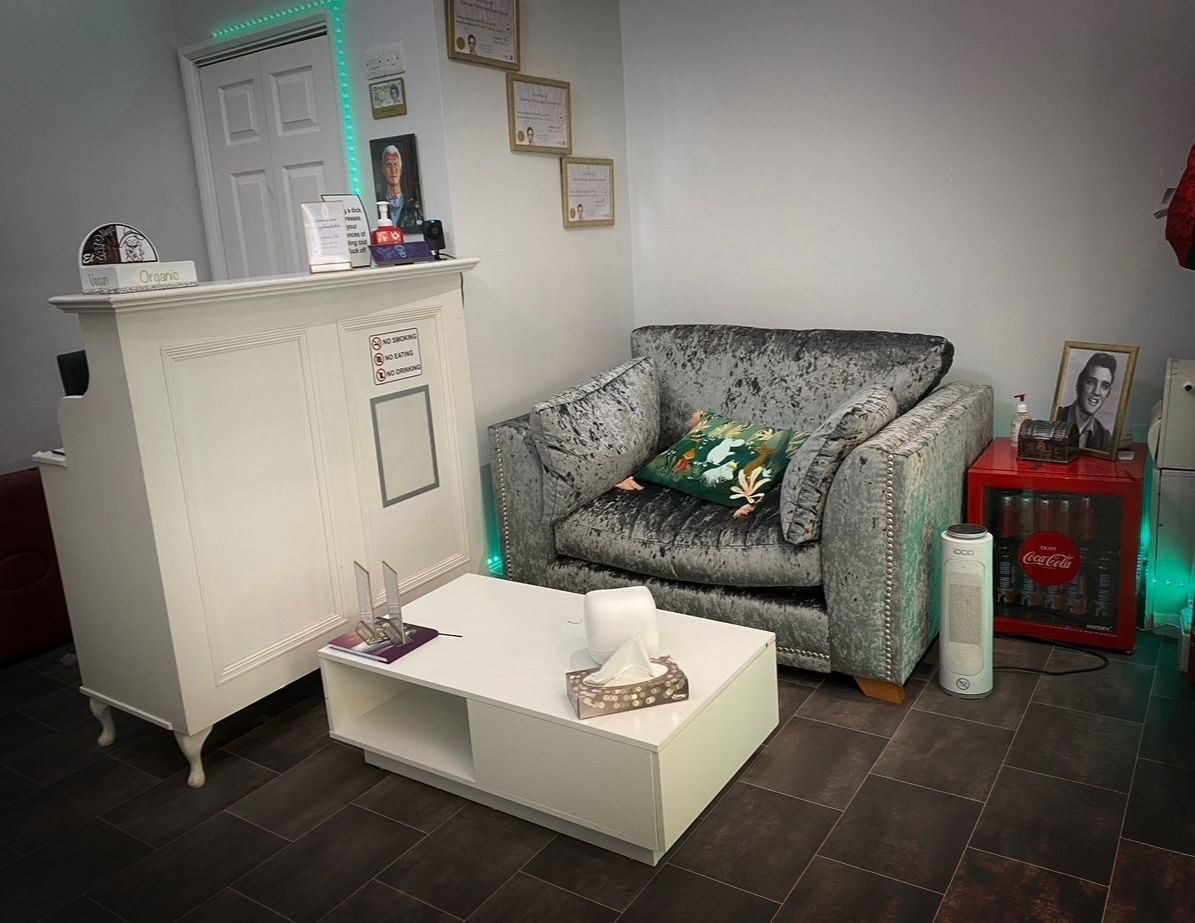 A living room with a couch and a coffee table.