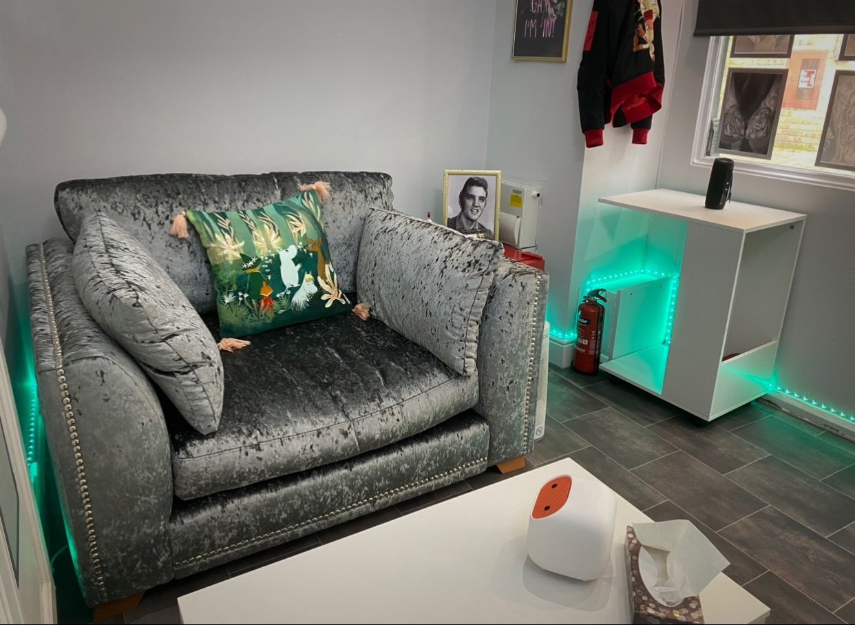 A living room with a couch and a coffee table.